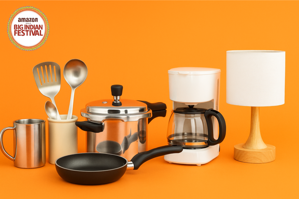Amazon Big Indian Festival 2025 banner with homeware and kitchen items including a pressure cooker, frying pan, utensils, coffee maker, and lamp on an orange background.
